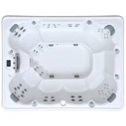 Vue de dessus du Spa 9 places D300, un grand spa rectangulaire blanc doté de multiples sièges moulés, de nombreux jets, d'un sol texturé et d'un panneau de contrôle sur un côté.