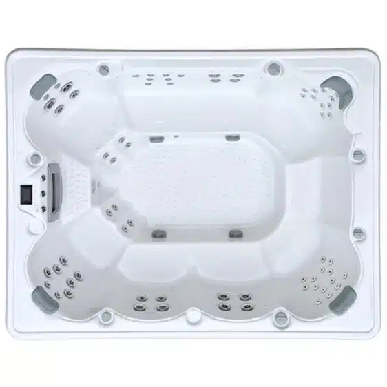 Vue de dessus du Spa 9 places D300, un grand spa rectangulaire blanc doté de multiples sièges moulés, de nombreux jets, d'un sol texturé et d'un panneau de contrôle sur un côté.