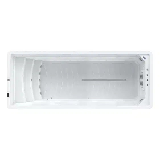 Vue de dessus du Spa de nage D600N, un grand spa de nage blanc rectangulaire et vide doté de parois intérieures lisses et de panneaux de commande à une extrémité.