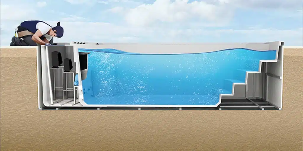 Un technicien travaille au bord d'un Spa de nage D600N partiellement enterré et en coupe transversale, exposant son eau intérieure, son système de filtration et ses marches sous-marines avec le ciel visible en arrière-plan.